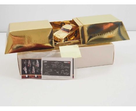 A CORGI James Bond Aston Martin DB5 ‘Goldfinger’ gold plated model, with gold Ingot Golden Opportunity presentation box. Scar