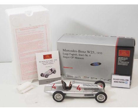 A CMC M-104 1/18 scale diecast Mercedes W25 1935 Luigi Fagioli #4 Sieger GP Monaco race car, with original tag and paperwork 