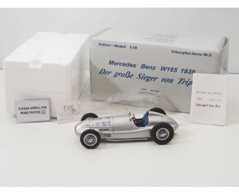 A CMC M-018 1/18 scale diecast Mercedes Benz W165 1939 Der GroBe Sieger Von Tripolis race car, with original tag and paperwor