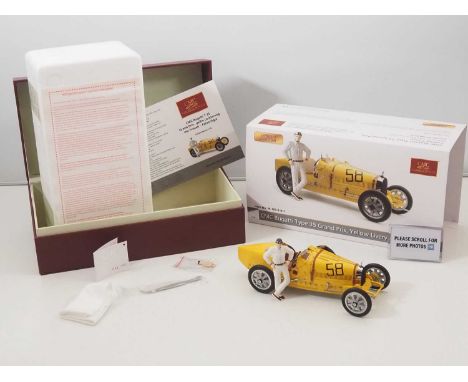 A CMC M-100-017 1/18 scale diecast Bugatti Type 35 Grand Prix, yellow livery with a female racer figurine race car, with orig