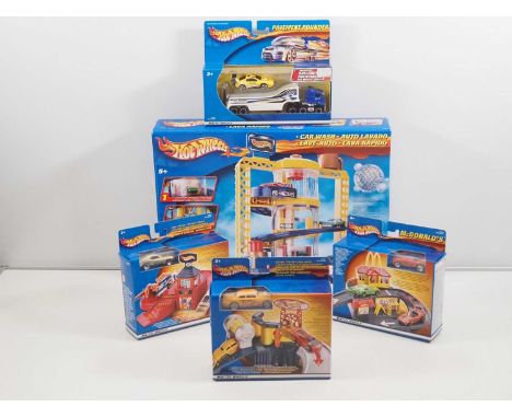 A group of MATTEL Hotwheels sets to include a Car Wash and McDonalds Drive Thru - VG/E in VG/E sealed boxes (5)
