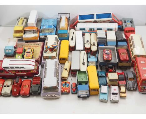 A large crate of vintage tinplate and plastic trams, buses, lorries etc mostly Eastern European/Czechoslovakian - F/G (unboxe