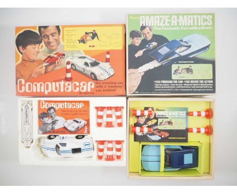 A METTOY Computacar programmable car toy together with an American equivalent HASBRO Amaze-A-Matics version - VG in F/VG boxe