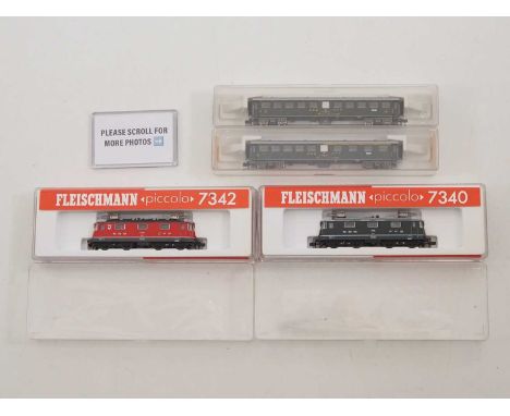 A group of FLEISCHMANN N gauge Swiss outline rolling stock comprising a 7340 Re4/4 II electric loco in SBB green, a similar 7