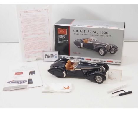 A CMC M-106 1/18 scale diecast Bugatti 57 SC 1938 Corsica Roadster touring car, with original tag, accessories and paperwork 