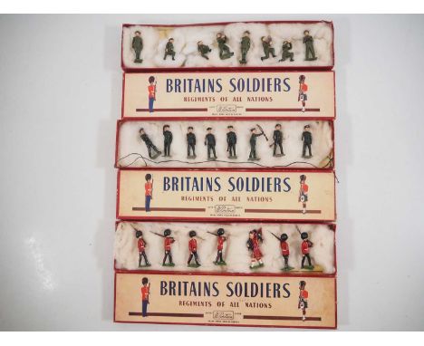 A group of vintage BRITAINS diecast soldier sets comprising 75 The Scots Guards, 1730 The Royal Artillery and 2091 Rifle Brig