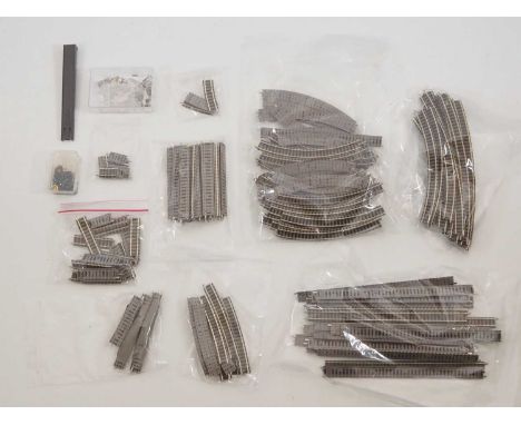 A group of FLEISCHMANN N gauge Piccolo unboxed track comprising straights, curves and accessories - VG unboxed (Q)