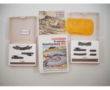 A pair of FLEISCHMANN N gauge Piccolo track sets comprising 9189 and 9190 together with a 9950 track plans book and a 9957 Sy
