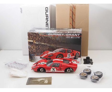 A GMP G1201307 1/12 scale diecast Ford GT40 MkII 1966 Gurney/Grant no. 3 race car, complete with all accessories and manual -