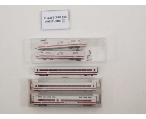 A FLEISCHMANN N gauge German outline ICE 1 5-car passenger trains comprising a pair of unboxed power cars (one with a damaged