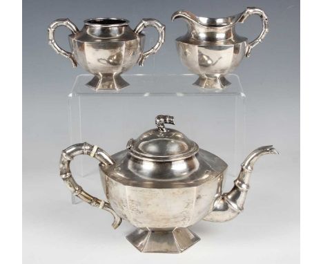 An early 20th century Chinese silver three-piece tea service of hexagonal form with simulated bamboo handles and finial, comp
