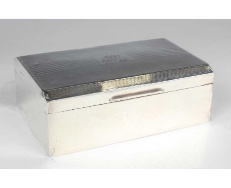 A George VI silver rectangular cigarette box, the engine turned hinged lid inscription engraved, Birmingham 1947 by J.B. Chat