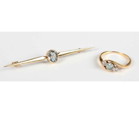 A 15ct gold and pale blue gem set single stone bar brooch, detailed '15ct', weight 2.8g, width 5.5cm, and a gold, diamond and