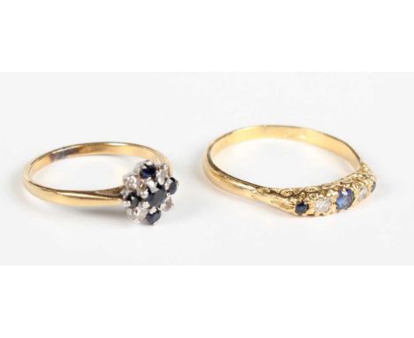 An 18ct gold, sapphire and diamond five stone ring, mounted with three circular cut sapphires alternating with two circular c