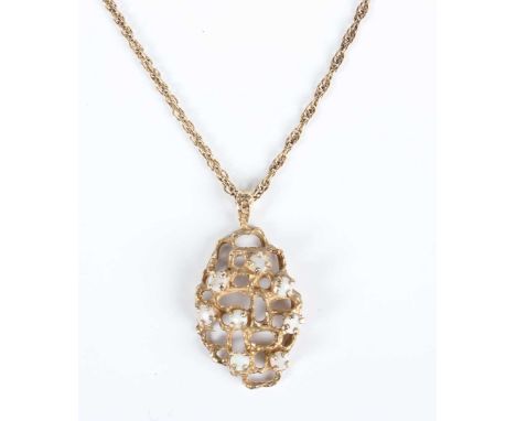 A 9ct gold and opal pendant, pierced in an abstract design, length 3.2cm, with a 9ct gold neckchain on a boltring clasp, leng
