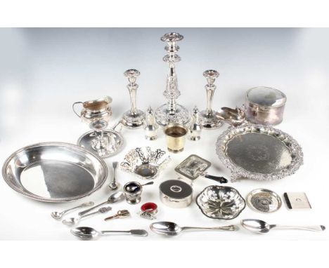 A group of plated items, including a candlestick, chamberstick and snuffer, card salver, biscuit box and pair of candlesticks