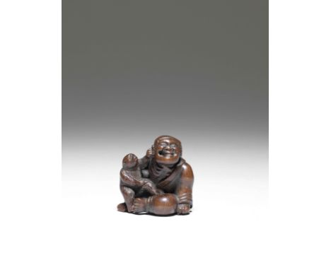 NETSUKE EN BOIS REPRÉSENTANT UN SARUMAWASHI ET SON SINGEPar Miwa, Edo, début du XIXe siècleA WOOD NETSUKE OF A SARUMAWASHI (M