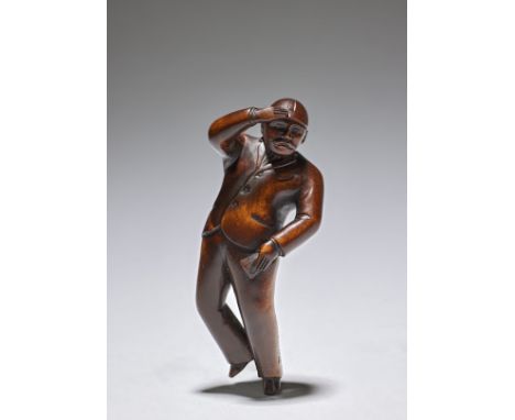 NETSUKE EN BOIS REPRÉSENTANT UN TURFISTEPar Miyazaki Joso (1855-1910), Tokyo, fin du XIXe siècleA WOOD NETSUKE OF A RACE-GOER