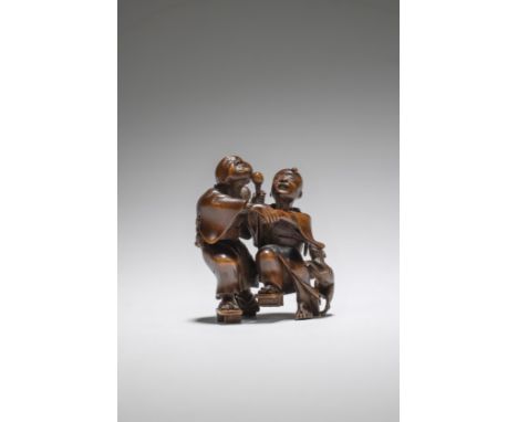 NETSUKE EN BOIS REPRÉSENTANT DES AVEUGLESPar Taketomo, XIXe siècleA WOOD NETSUKE OF BLIND MENBy Taketomo, 19th centuryThe two