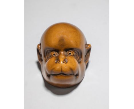 NESTUKE EN BOIS REPRÉSENTANT UN MASQUE DE KYOGENXIXe siècleA WOOD NETSUKE KYOGEN MASK19th centuryRepresenting Saru (Monkey), 