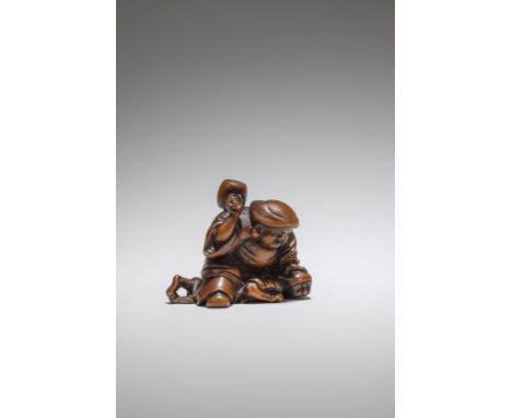 NETSUKE EN BOIS REPRÉSENTANT DAIKOKUPar Hojitsu, fin du XIXe siècleA WOOD NETSUKE OF DAIKOKUBy Hojitsu, late 19th centuryDaik