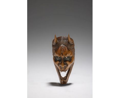 NETSUKE EN BOIS REPRÉSENTANT UN MASQUE D'HANNYAXIXe siècleA WOOD NETSUKE OF A HANNYA MASK19th centuryThe long face with mouth