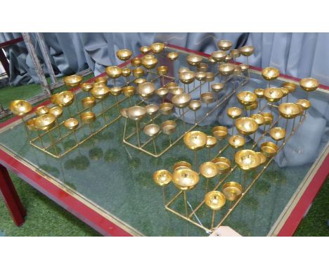 TEA LIGHT CENTER PIECES, a set of three, gilt metal, 54.5cm x 13.5cm x 12cm approx. (3) 