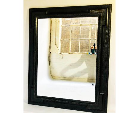 WALL MIRROR, 17th century style ebonised with ripple moulded cushion frame and bevelled mirror plate, 122cm x 152cm H. 