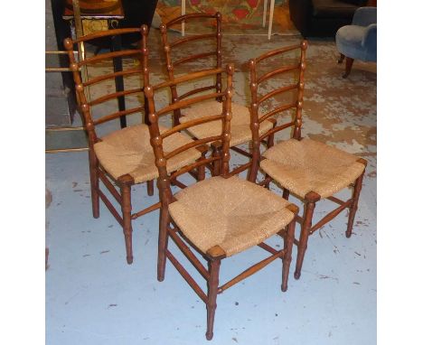 DINING CHAIRS, a set of four, late 19th/early 20th century birch, each with a ladder back and a rush seat joined by stretcher