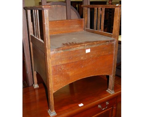 An Edwardian oak commode