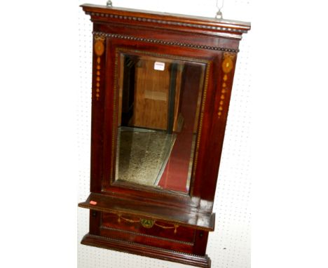 An early 20th century mahogany and polychrome painted wall mirror, having rectangular bevelled plate with shelf below 