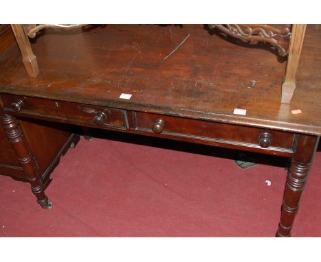 A Victorian mahogany side table having two frieze drawers on ring turned supports