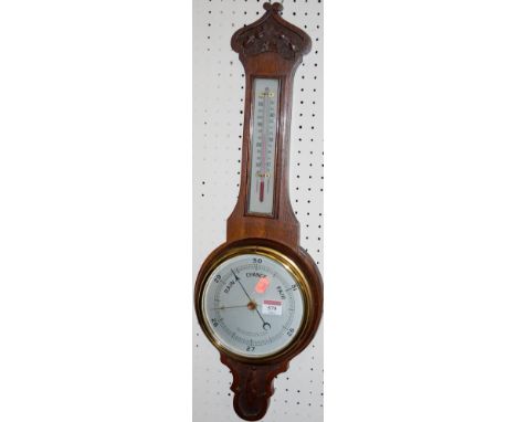 A mid-20th century oak cased aneroid barometer