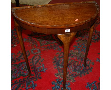 A reproduction stained beech and mahogany demi lune hall table together  with a wrought iron standard lamp (2)