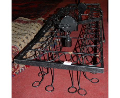 A black painted iron ceiling light fitting of rectangular form 