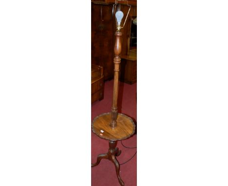 A George III style walnut table top standard lamp on a turned and fluted column and tripod base