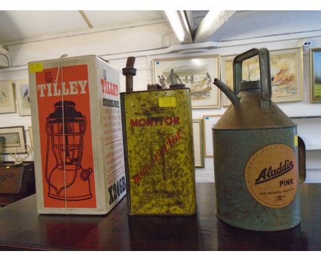 A vintage Aladdin heater, an Aladdin Pink Paraffin can, a Monitor Monovicter filler can, a boxed Tilly stormlight, and a Herm