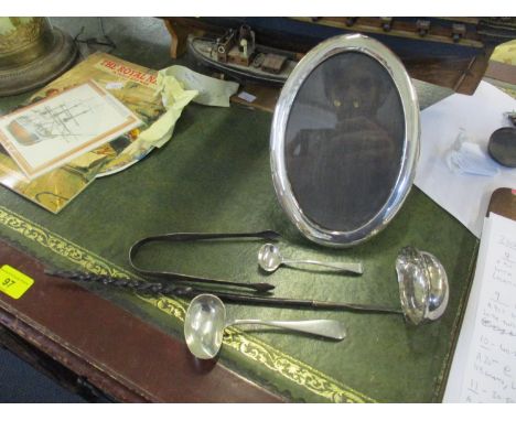 A pair of silver sugar tongs by Hester Bateman together with a silver caddy ladle with whole bone handle, a silver invalid sp