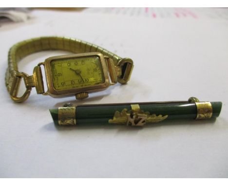 A vintage wrist watch with 9ct gold case together with a 9ct gold mounted jade broochLocation: Cab 