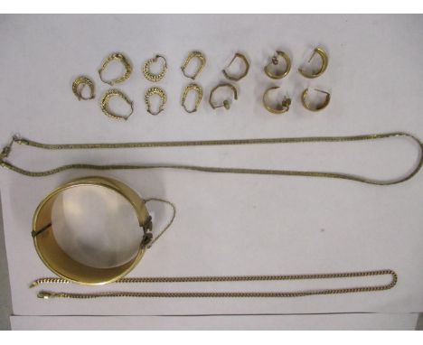 A 9ct gold chain stamped 375, 5.2g together with an 18ct gold plated necklace, a 1/5th 9ct gold core bangle together with 3 1