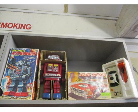 Two vintage boxed toys comprising a Super Rotate-o-matic Astronaut battery operated robot and a Sonic Control battery operate