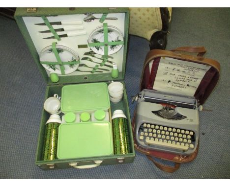 A vintage Royal 'Royalite' typewriter together with a Brexton picnic setLocation: A4 