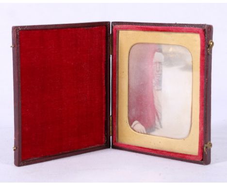 Victorian daguerrotype portrait photograph of a gentleman, in a gilt labelled red leather case, 9.5cm x 8.5cm.