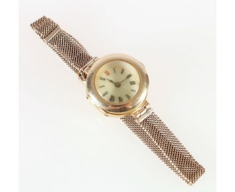 18ct gold ladies watch, with enamel Roman dial, on a 9ct gold mesh bracelet, 23g gross.