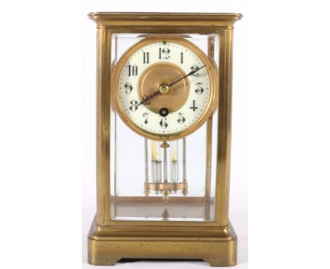 Early 20th century French brass four-glass timepiece, with enamel Arabic numeral dial, 23cm.