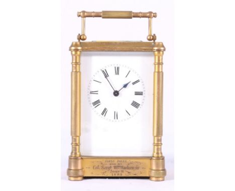Late 19th century French brass carriage timepiece, with Roman enamel dial, with military engraving, dated 1884, 16.5cm.