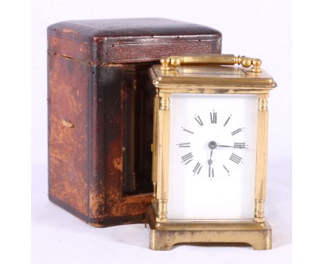 French brass carriage timepiece with enamel Roman dial, compensated platform escapement, the case with hexagonal curved handl