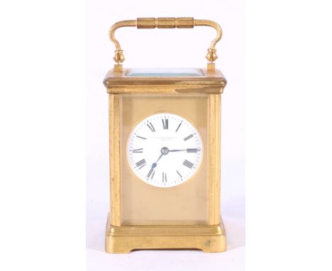 Goldsmiths and Silversmith of London brass carriage clock, c1924, with circular enamel Roman dial, compensated platform escap