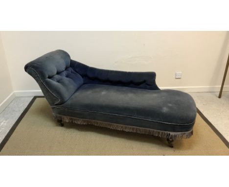 A Victorian buttoned upholstered chaise longue by James Shoolbred of Tottenham Court Road, London, upholstered in blue velvet
