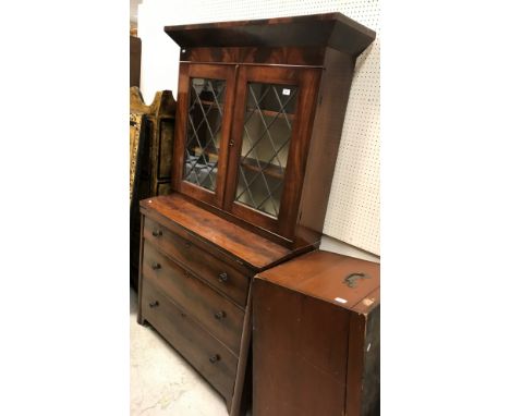 A 19th Century figured mahogany secretaire bookcase, the upper section with canted cornice over two leaded glazed panelled do